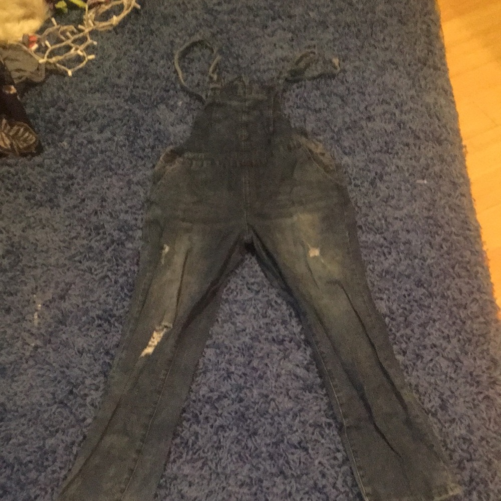 Dark washed ripped denim overalls